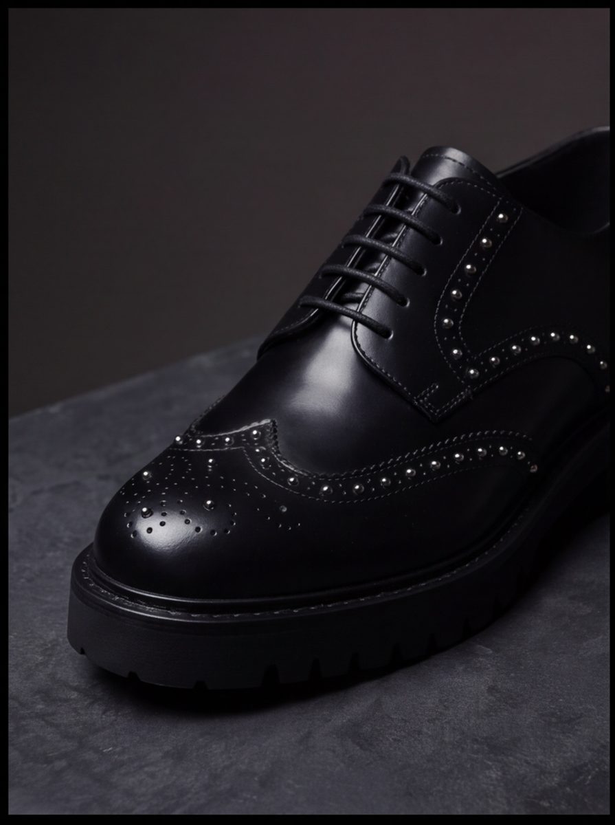 Brogue Riot Derby — studded wingtip, lug sole